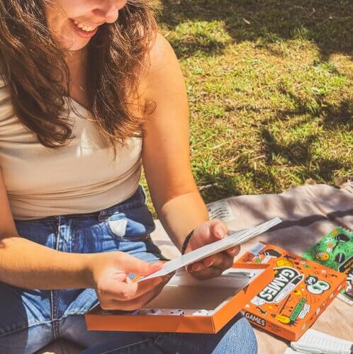 girl-holding-erasable-pen-on-paper-games