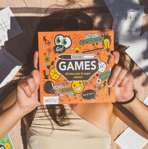 girl-showing-MOYY-erasable-game-box